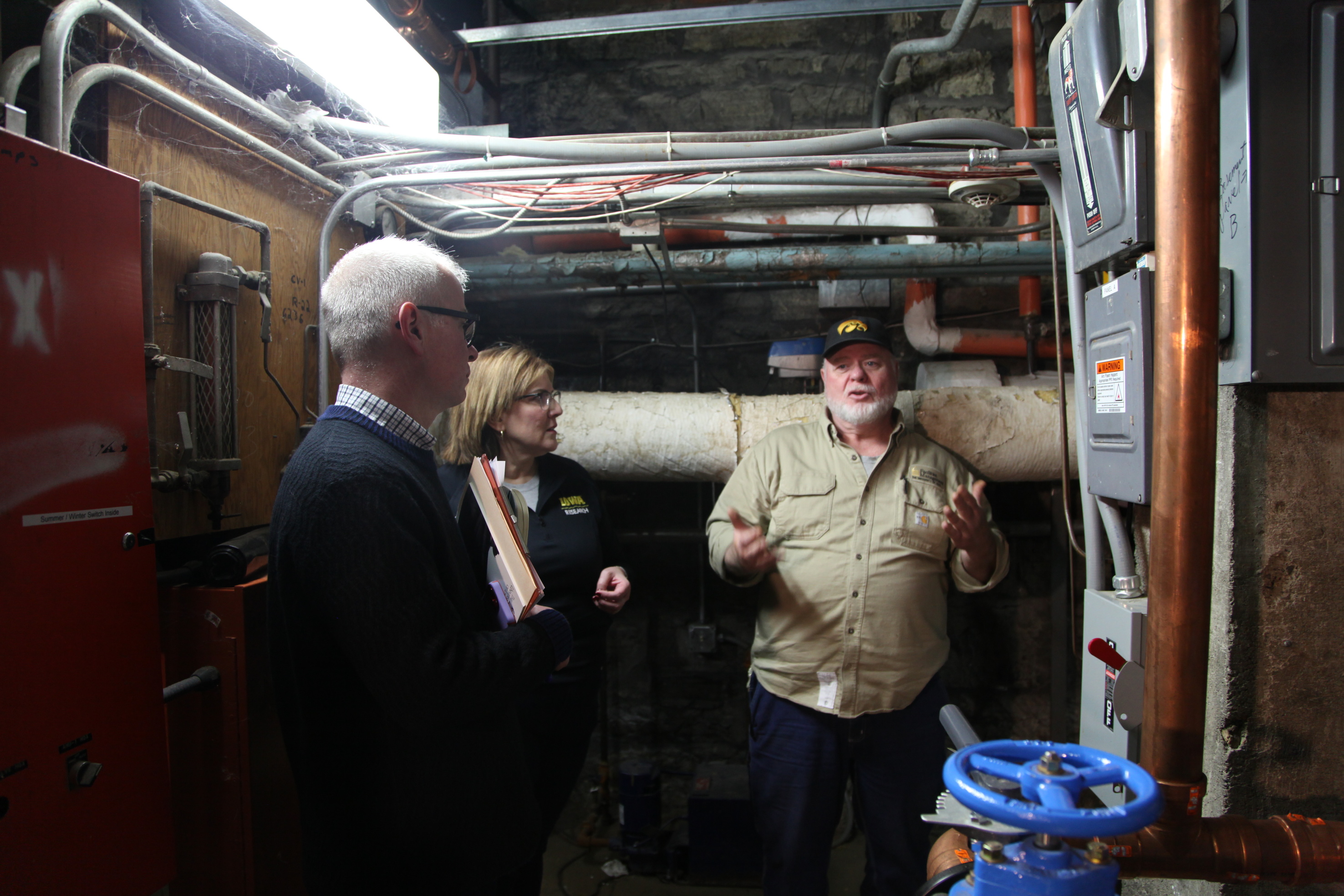 Assessors meet with FB in subbasement of Macbride Hall to better understand infrastructure for assessment report. 